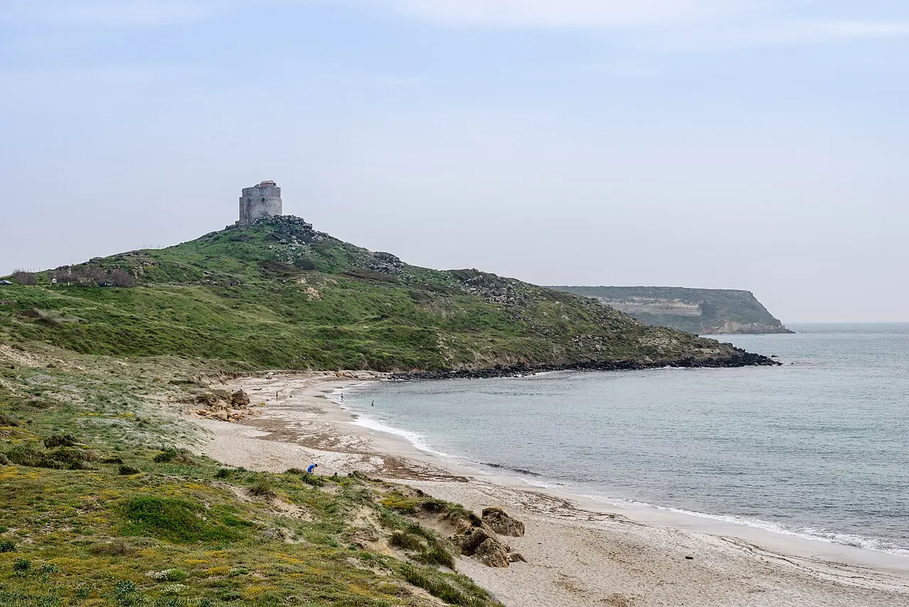 Beach near Tharros (ancient city ruins) on the west coast, province of Oristano, Sardinia, Italy. A Spanish watchtower in visible in the bac