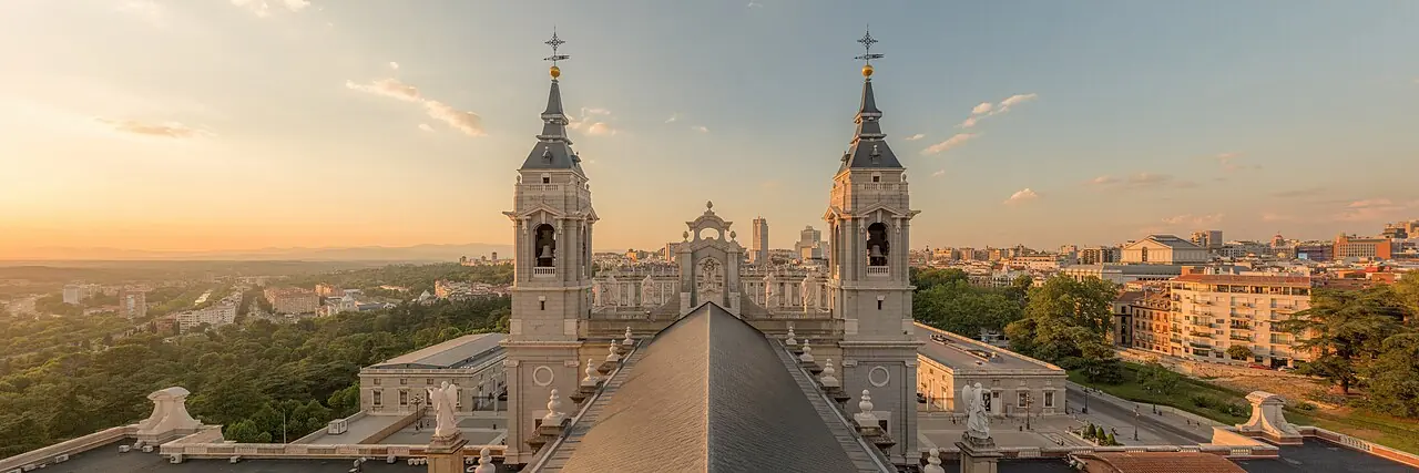 View from the dome of the Almudena Cathedral, in Madrid, Spain. Behind the bell towers, the Royal Palace is visible, as well as some of the