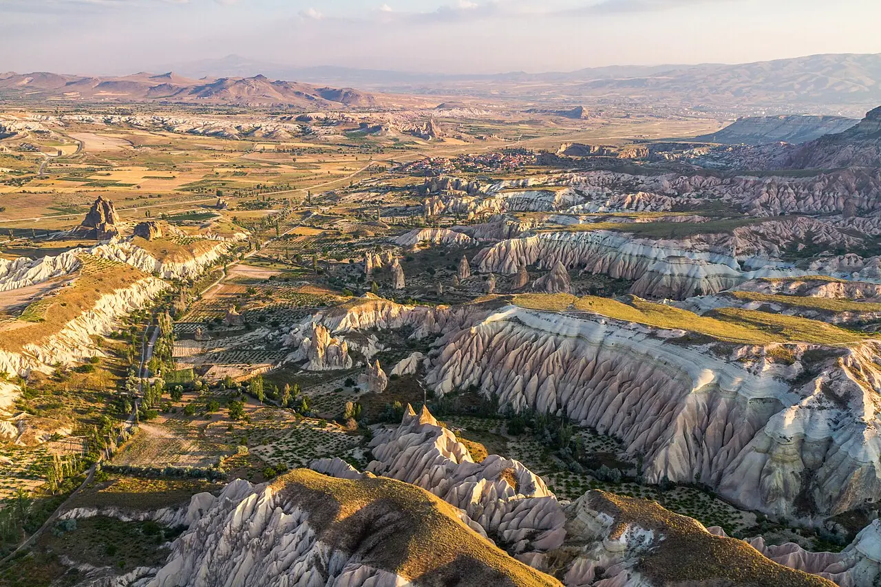 Aerial view over Cappadocia, nearby Gorëme, Turkey. Features from very far top to bottom, the city of Avanos, its small village Çavusin and