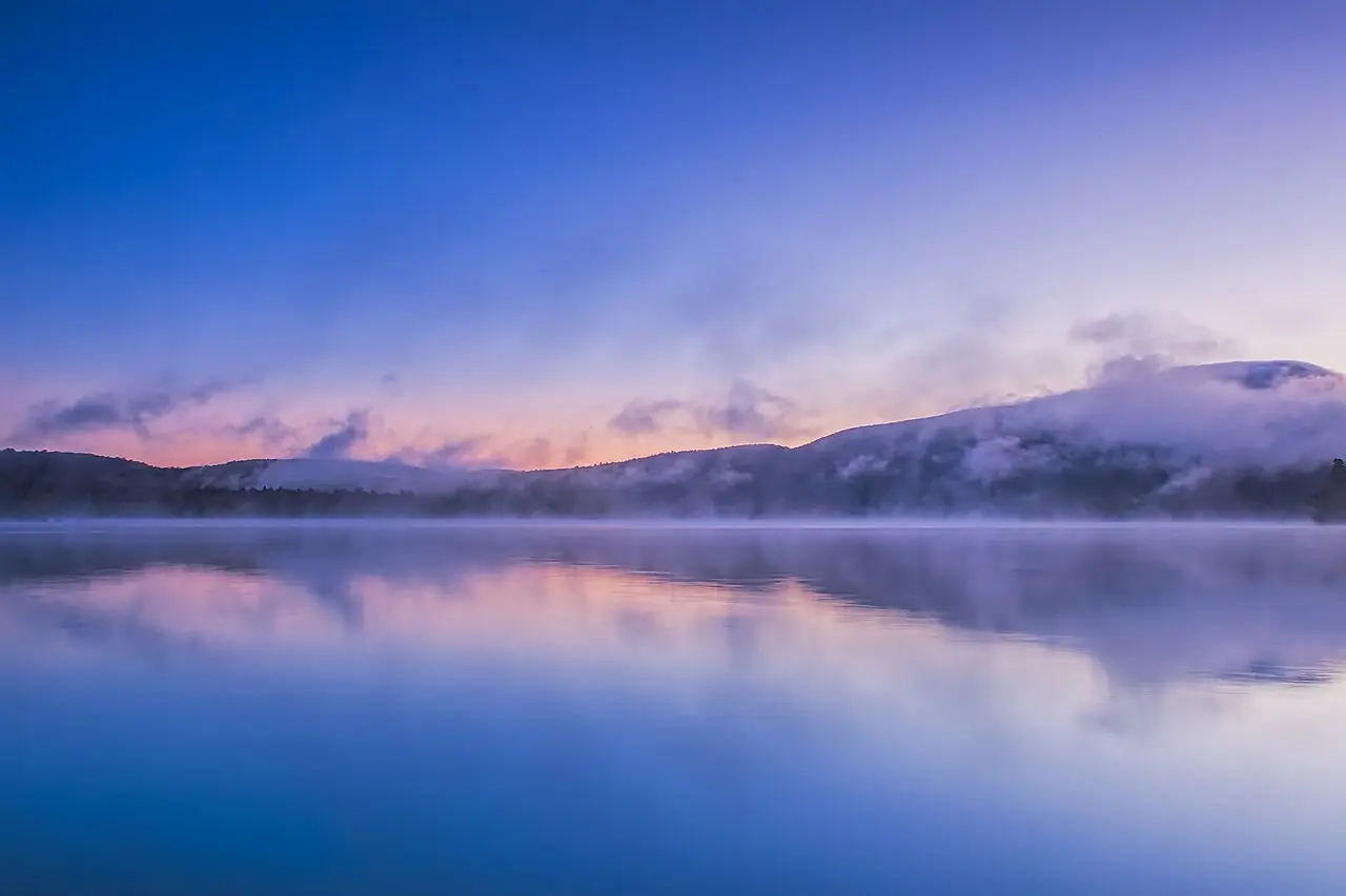 This was the scene one October morning overlooking Blue Mountain Lake in the Adirondacks National Park. I used a graduated ND filter to bala